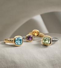 Image of David Yurman rings on grey background. Tap to Shop new jewellery image