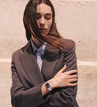 Female model wearing tissot watch. Tap to shop ladies tissot watches image