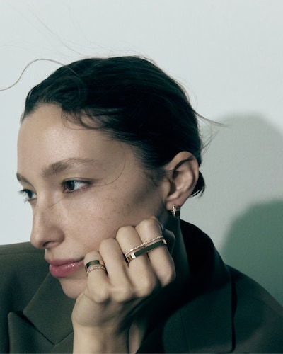 Repossi model wearing earrings and rings. Tap to shop all repossi jewellery image