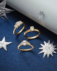 Image of mixed engagement rings on blue moon and star background - tap to shop all engagement rings image