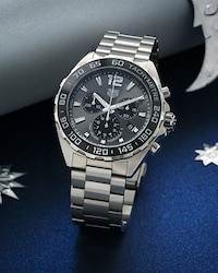 Image of tag heuer watch on blue moon and star background - tap to shop all watches image