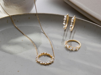 Image of diamond necklace, earrings and ring on ceramic plate background - tap to shop all gifts for her image