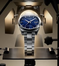 Tissot watch on mechanical background. tap to shop classic watches for fathers day image