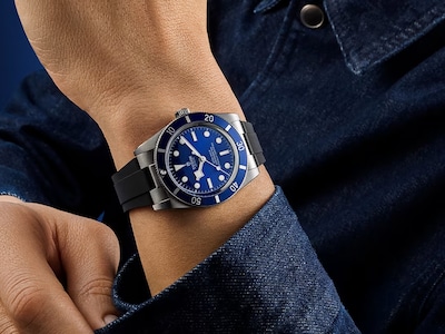 Image of Tudor watch in blue on male wrist - tap to shop gifts for him image