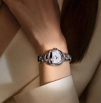Image of gucci horsebit watch on model background. tap to shop all gucci watches image