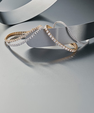Crafted above ground, perfected by innovation. Image of Mappin & Webb Lab Grown bracelets on silver background. Tap to shop all Mappin & Webb Lab Grown Diamond jewellery. image