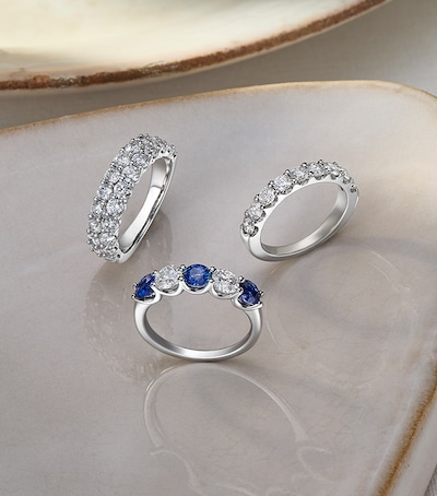 Image of ladies wedding rings in ceramic dish. tap to shop all ladies wedding rings image