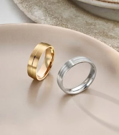 Image of mens wedding rings in ceramic dish. tap to shop all mens wedding rings image