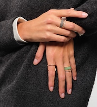 Repossi rings on female model Tap to shop Repossi rings image