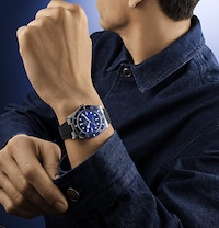 Model wearing Tudor watch - tap to shop all tudor watches image
