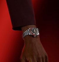 Male model wearing Tudor watch - tap to shop all mens tudor watches image